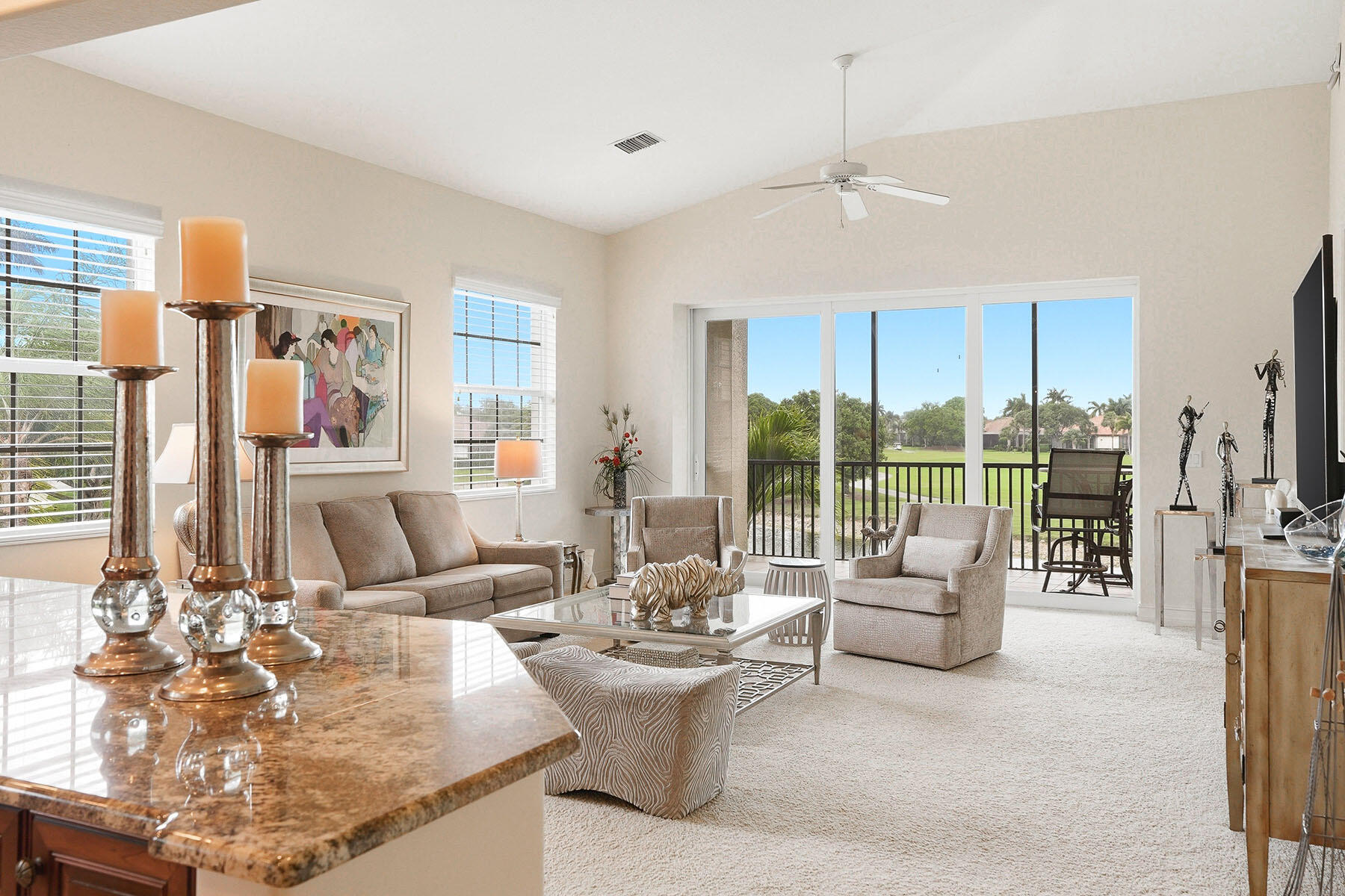 8605 Champions Point, Unit 103 Naples, FL 34113 - Photo 12 of 44 a living room with furniture and a large window