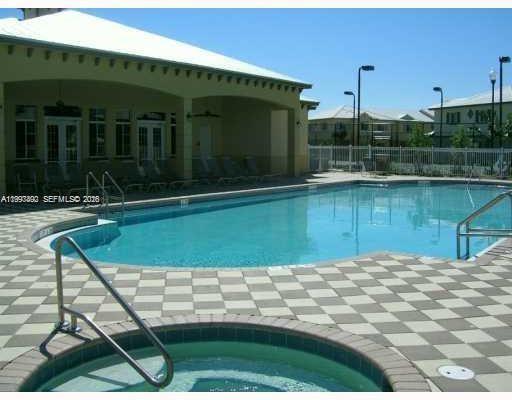 1114 Lucaya Drive Riviera Beach, FL 33404 - Photo 4 of 6 a view of a swimming pool with a patio
