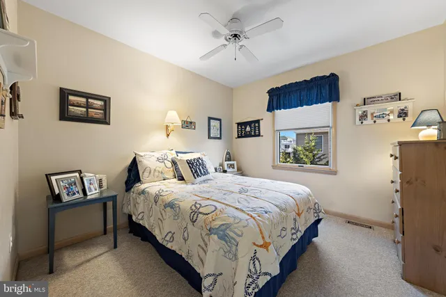 a bedroom with bed and a window