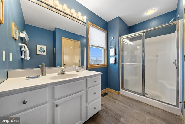 a bathroom with a double vanity sink and mirror
