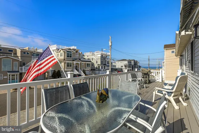 a view of a balcony with a patio
