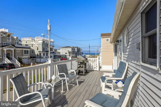 a terrace of a house with outdoor seating