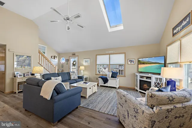 a living room with furniture fireplace and a flat screen tv