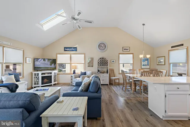 a living room with furniture a fireplace and a table