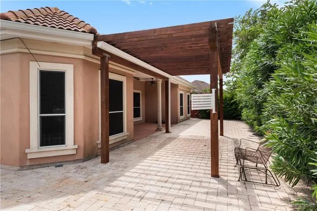 an aerial view of a house with outdoor space and lake view