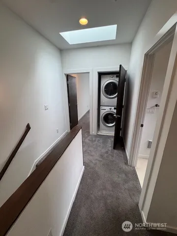 a bathroom with a sink mirror and shower