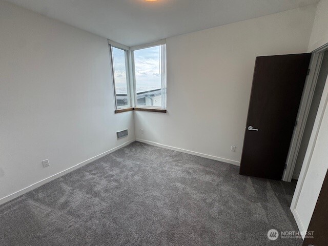 4503 15th Avenue South, Unit B Seattle, WA 98108 - Photo 15 of 25 an empty room with windows