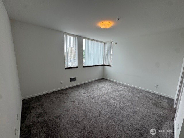 4503 15th Avenue South, Unit B Seattle, WA 98108 - Photo 17 of 25 an empty room with windows