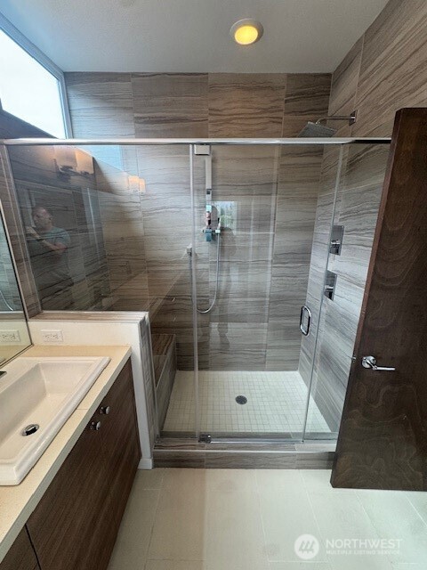 4503 15th Avenue South, Unit B Seattle, WA 98108 - Photo 20 of 25 a bathroom with a shower and a sink