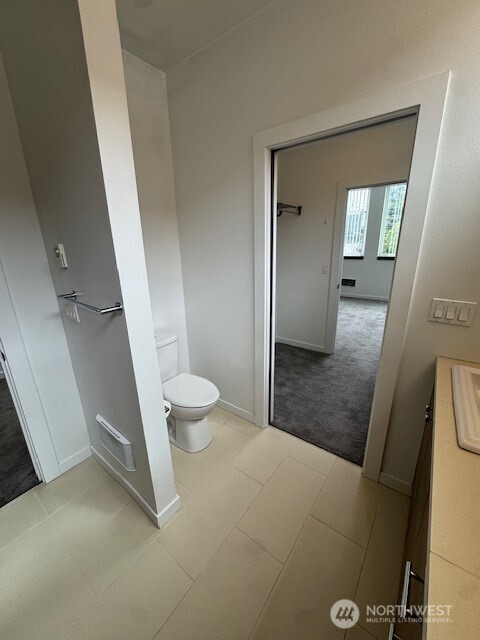 4503 15th Avenue South, Unit B Seattle, WA 98108 - Photo 21 of 25 a bathroom with a sink and toilet
