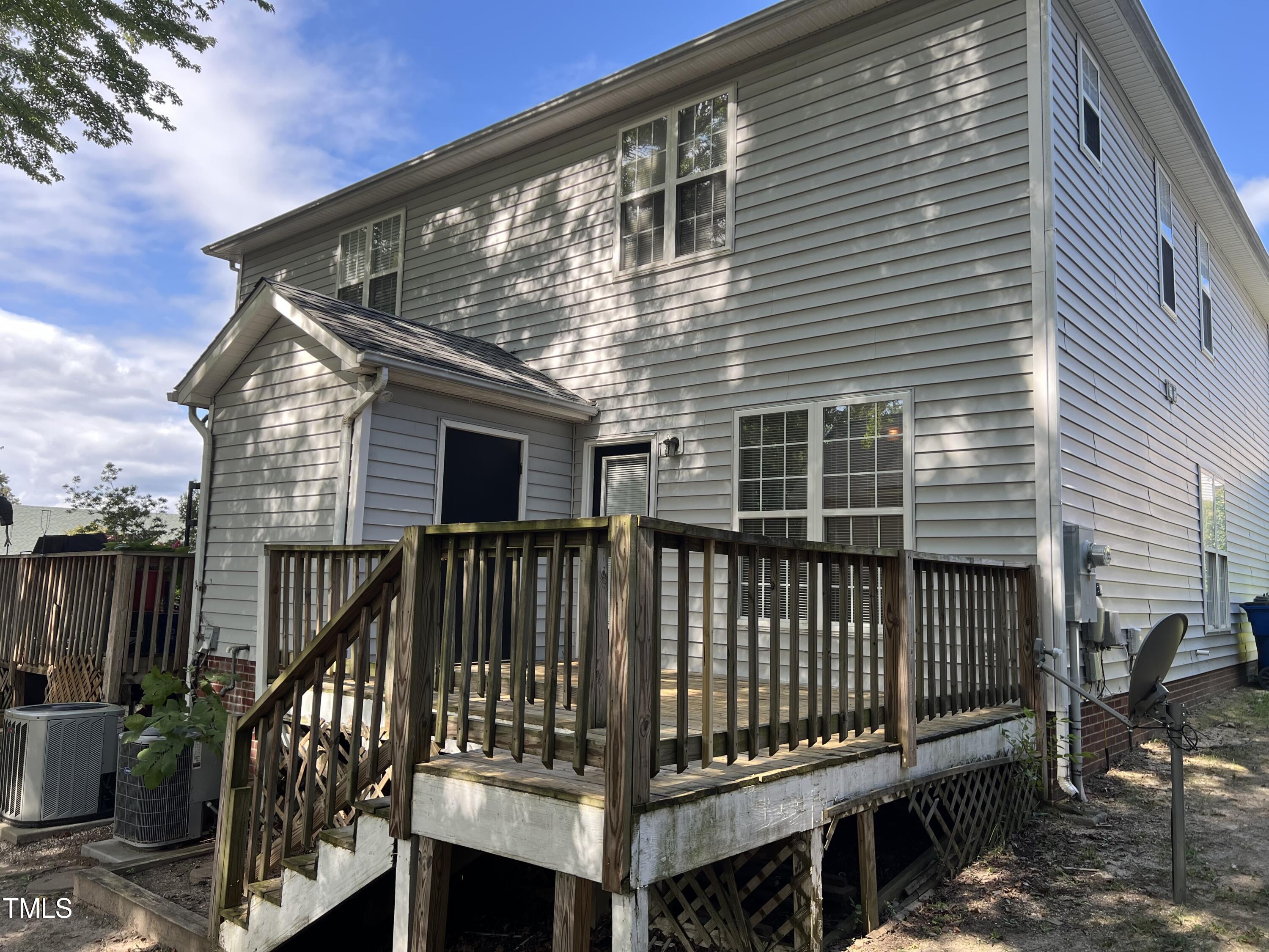 2032 Turtle Point Drive Raleigh, NC 27604 - Photo 17 of 18 a view of a house with a wooden deck