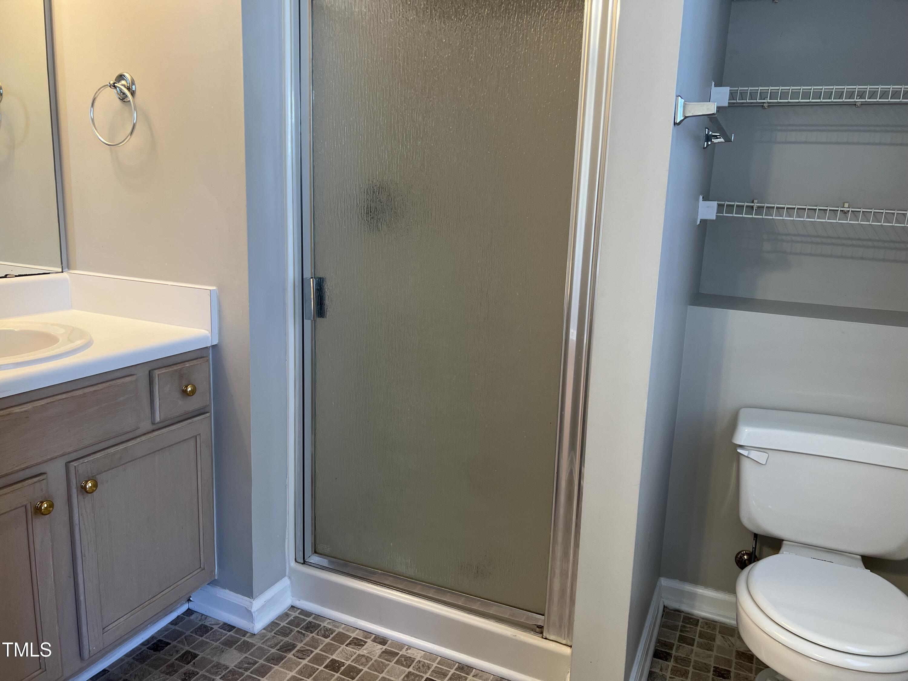 2032 Turtle Point Drive Raleigh, NC 27604 - Photo 10 of 18 a bathroom with a toilet and a shower