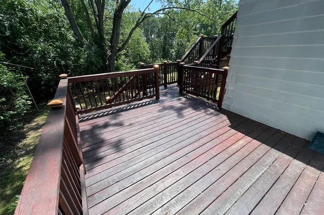 a view of deck with wooden floor and outdoor seating