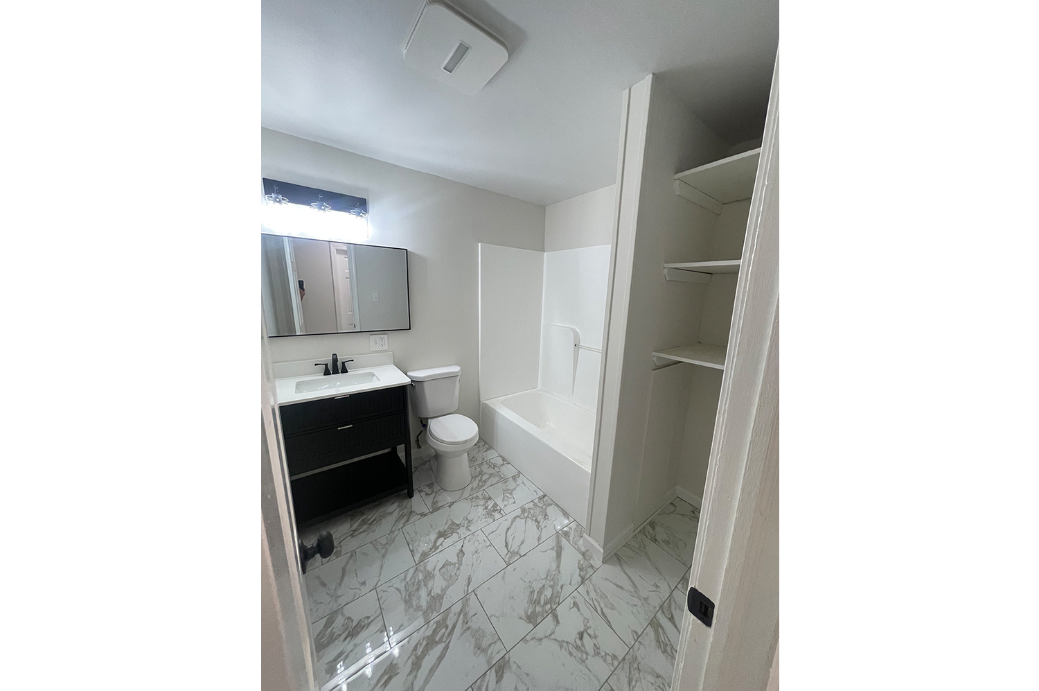 235 Russell Street, Unit 1 New Haven, CT 06513 - Photo 3 of 19 a spacious bathroom with a sink and a mirror