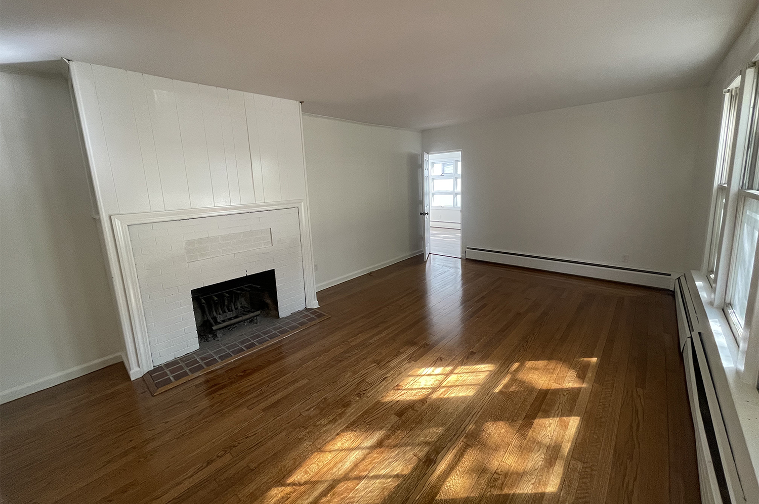235 Russell Street, Unit 1 New Haven, CT 06513 - Photo 5 of 19 a view of a livingroom with wooden floor and a fireplace