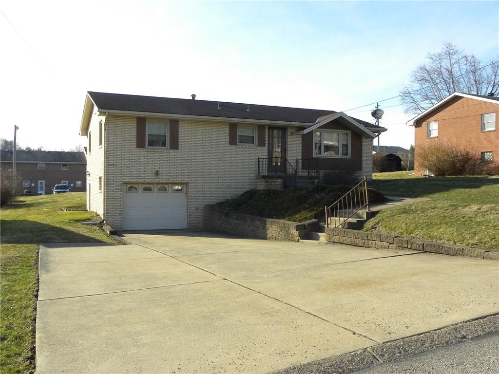 Welcome home to 222 Roth Street in the Allison Hollow plan of Houston, PA