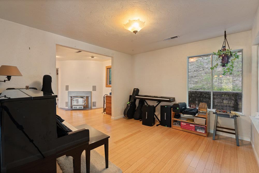 4760 Soquel Creek Road Soquel, CA 95073 - Photo 12 of 29 a living room with furniture and a flat screen tv