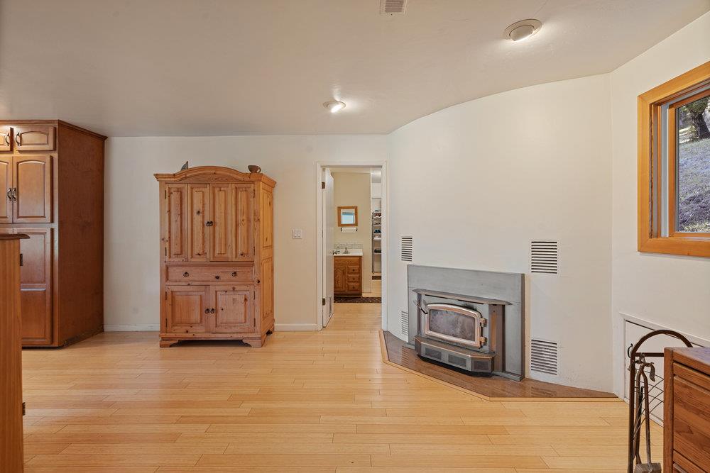 4760 Soquel Creek Road Soquel, CA 95073 - Photo 13 of 29 a view of a livingroom with a fireplace and window