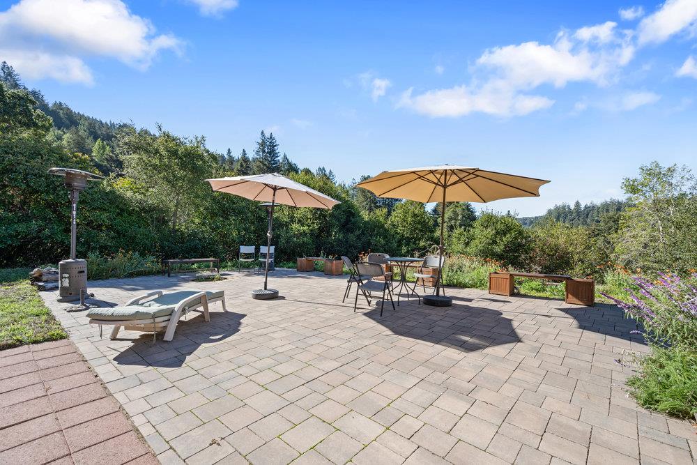 4760 Soquel Creek Road Soquel, CA 95073 - Photo 23 of 29 a view of a patio with chairs and tables
