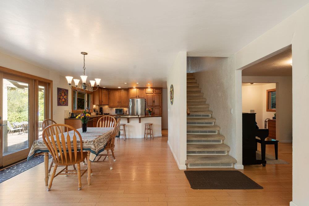 4760 Soquel Creek Road Soquel, CA 95073 - Photo 3 of 29 a view of a dining room with furniture window and wooden floor