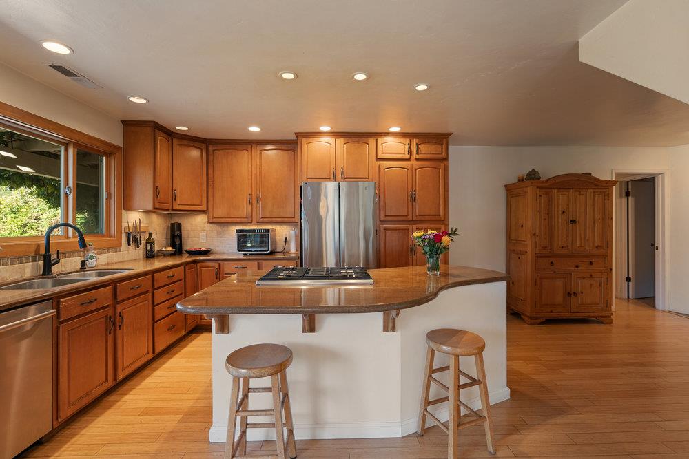 4760 Soquel Creek Road Soquel, CA 95073 - Photo 10 of 29 a kitchen with stainless steel appliances granite countertop a sink and a refrigerator