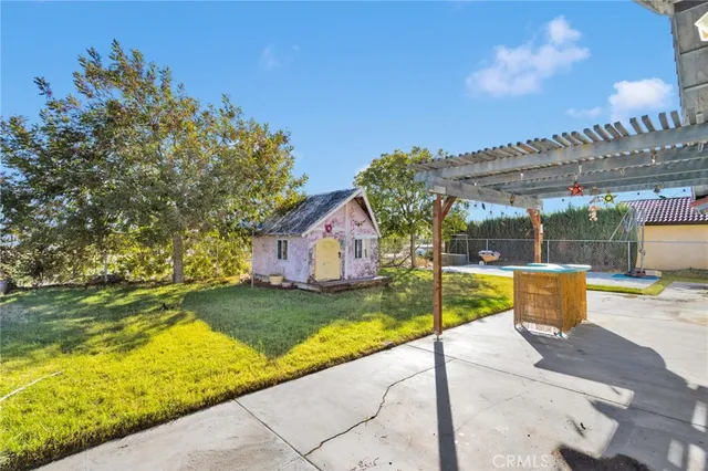 a view of a backyard with swimming pool