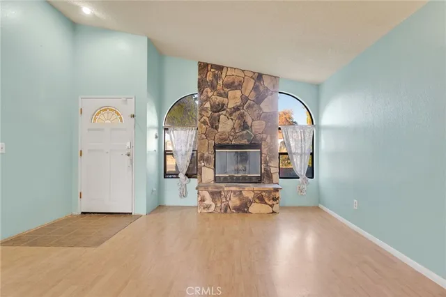 a view of a livingroom with furniture and window