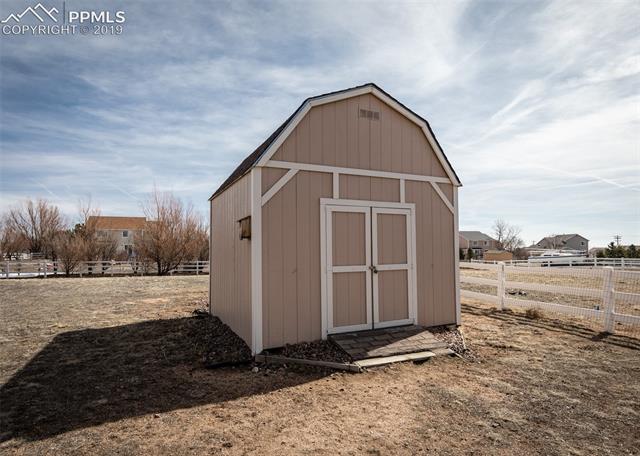 8587 Saddleman Road Peyton, CO 80831 - Photo 27 of 31 Storage shed in back yard