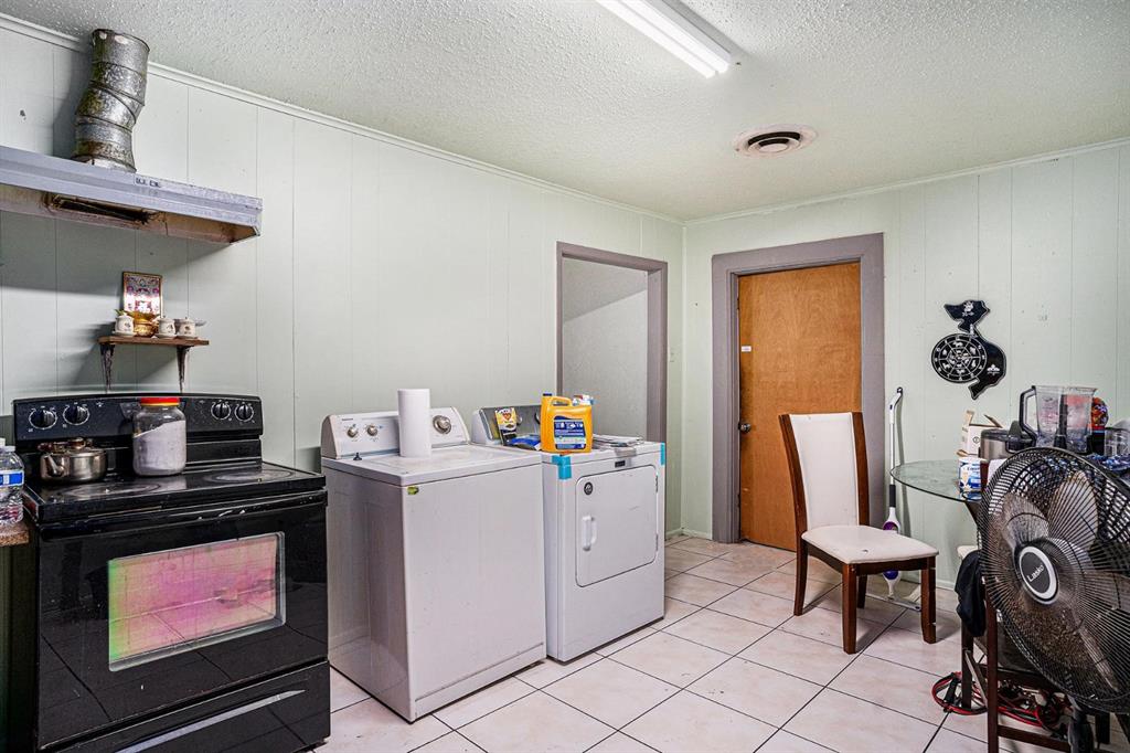 4501 Parrish Road Haltom City, TX 76117 - Photo 5 of 13 a room with storage and utility