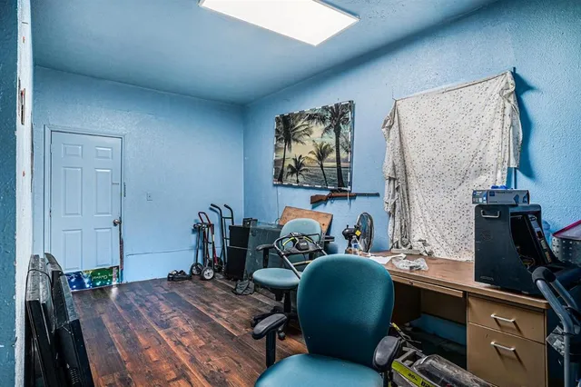 a room with furniture and wooden floor