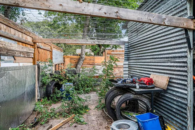 a close up of a sink a fire pit and potted plant