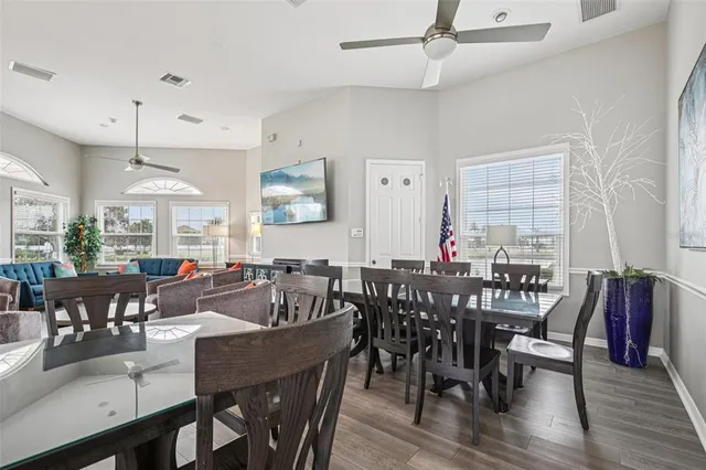 a view of a dining area with furniture window and wooden floor