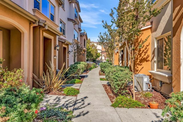 a spacious bathroom with a double vanity sink toilet and a tub