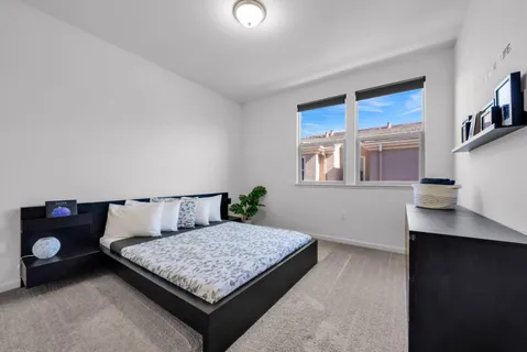 a room with a dresser and a window