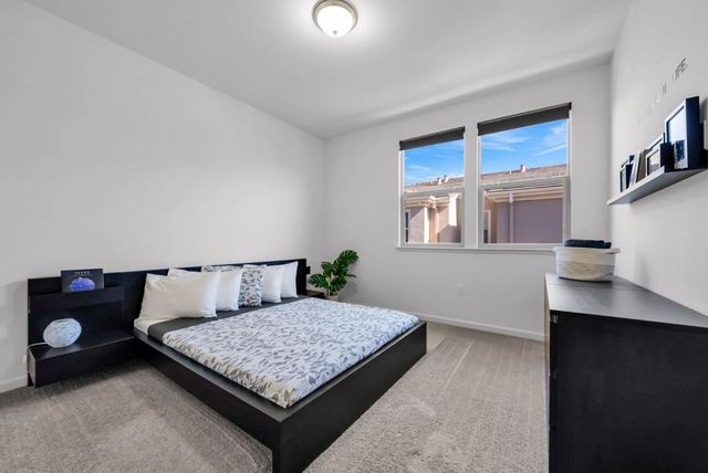 a room with a dresser and a window