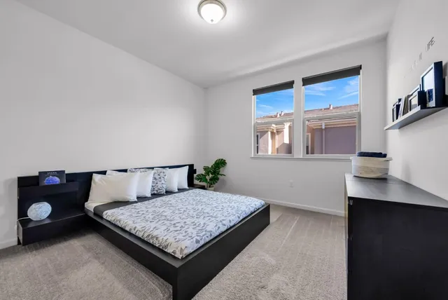 a room with a dresser and a window