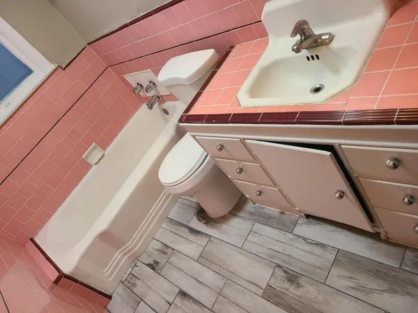 a bathroom with a sink and mirror