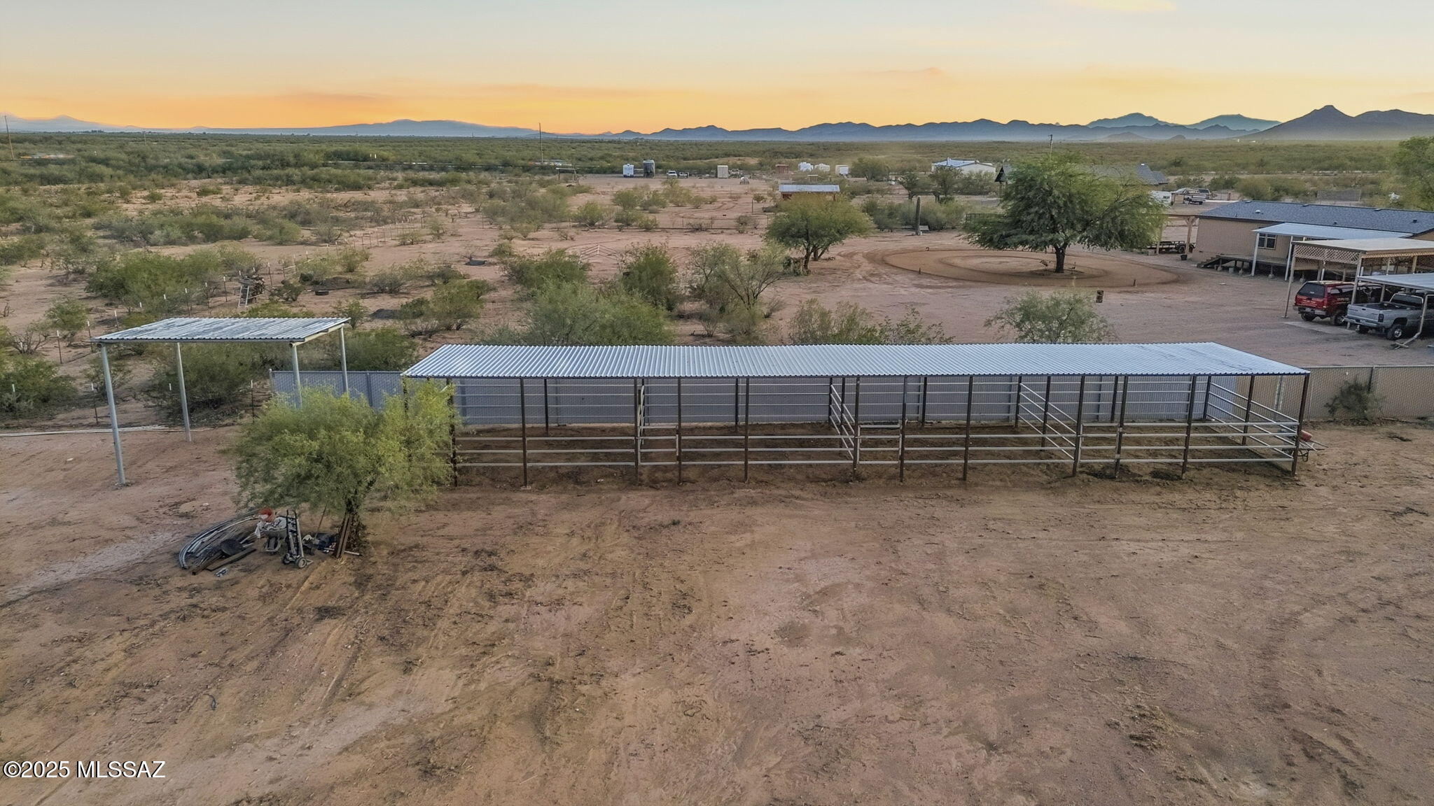 9740 North Running Back Way Marana, AZ 85653 - Photo 3 of 34 New 5inch galvanized pipe-chain link fence, 4 stalls & hay barn
