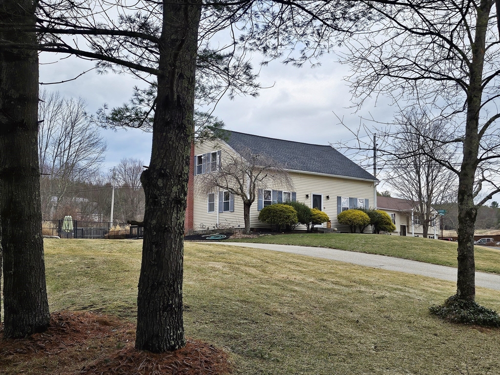 10 Campbell Road Ware, MA 01082 - Photo 1 of 41 a front view of a house with garden and trees