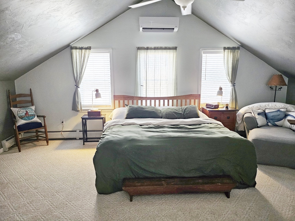 10 Campbell Road Ware, MA 01082 - Photo 17 of 41 a bedroom with a bed a table and window