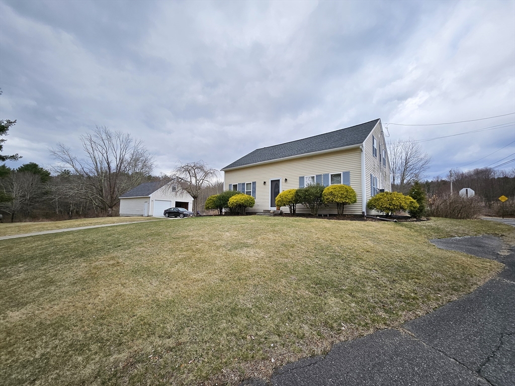 10 Campbell Road Ware, MA 01082 - Photo 3 of 41 a front view of a house with a garden and mountain view