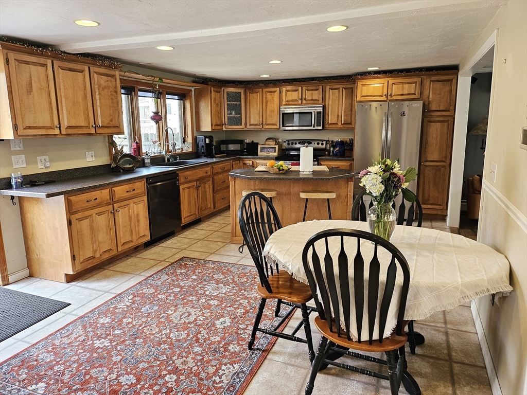 10 Campbell Road Ware, MA 01082 - Photo 5 of 41 a kitchen with stainless steel appliances granite countertop a kitchen island hardwood floor sink and stove