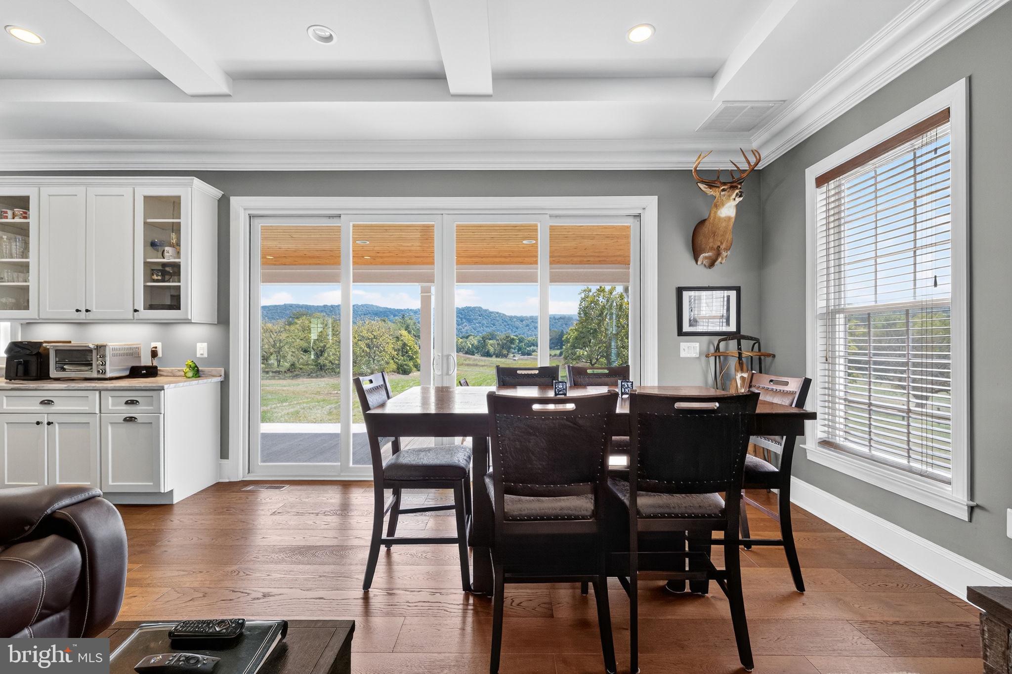 620 Tilthammer Mill Road Boyce, VA 22620 - Photo 11 of 57 a view of a dining room with furniture window and wooden floor