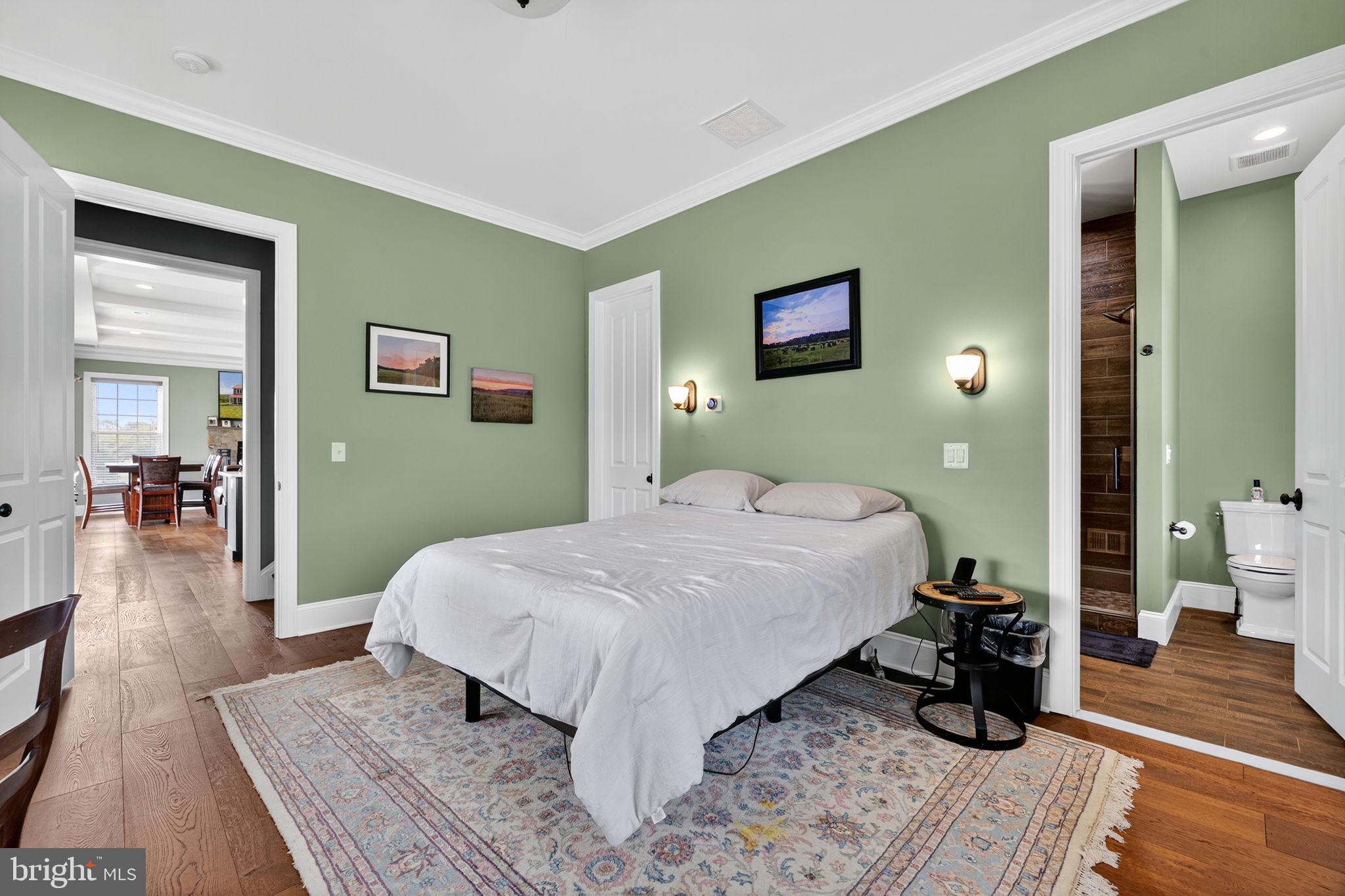 620 Tilthammer Mill Road Boyce, VA 22620 - Photo 22 of 57 a bedroom with a bed and wooden floor