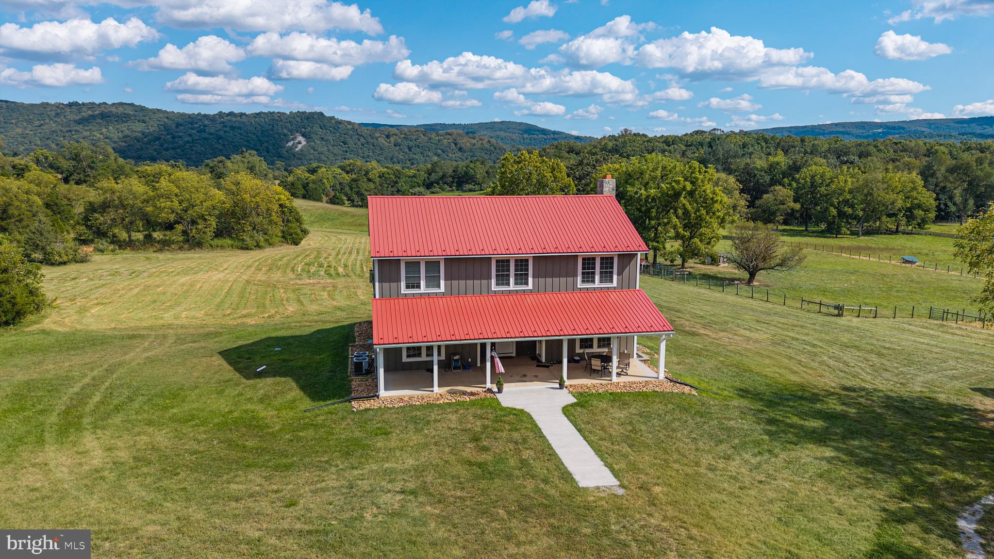 620 Tilthammer Mill Road Boyce, VA 22620 - Photo 3 of 57 a view of a swimming pool with lawn chairs and a yard