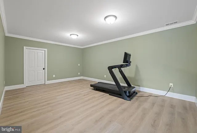 a view of kitchen with stainless steel appliances granite countertop a refrigerator and a stove top oven