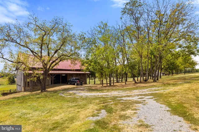 a view of a patio with table and chairs