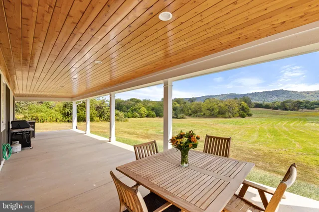 a view of a balcony with lake view and a ocean view