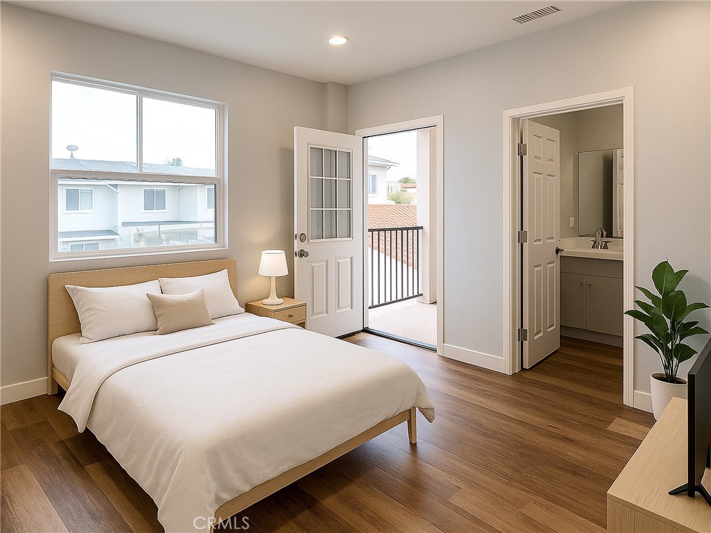 300 East Alhambra Road, Unit E Alhambra, CA 91801 - Photo 7 of 24 a bedroom with a bed and wooden floor