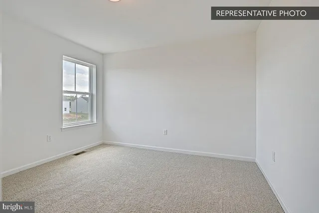 a kitchen with a sink dishwasher and cabinets